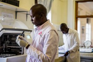 MSF Employee performing lab test